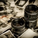 A photo of camera lenses and photographs