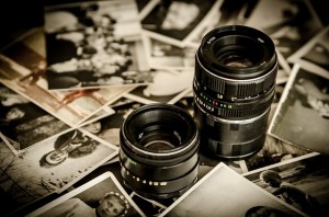 A photo of camera lenses and photographs